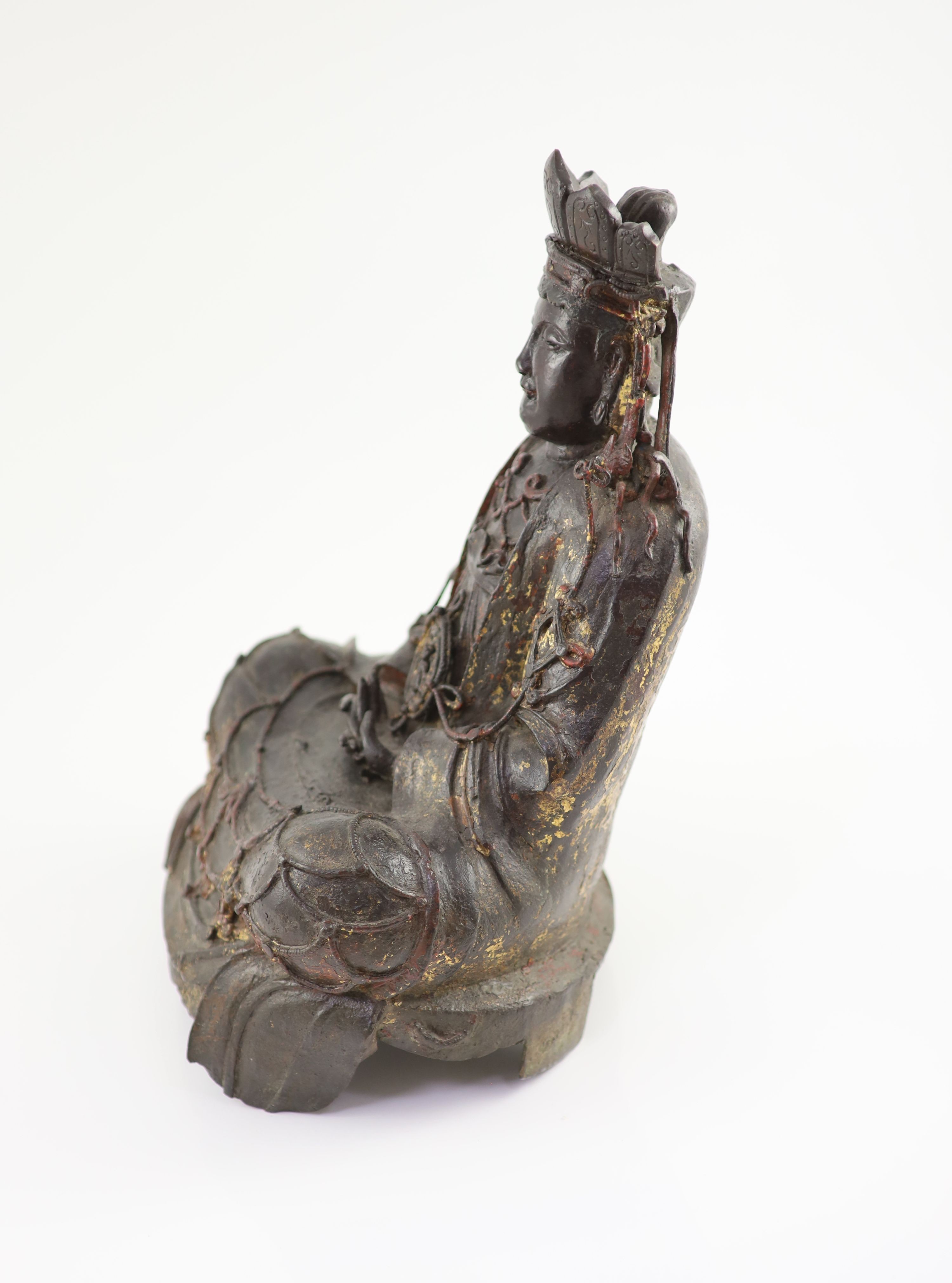 A large Chinese Ming bronze figure of a Bodhisattva, 16th/17th century, 41.5cm high, minor losses